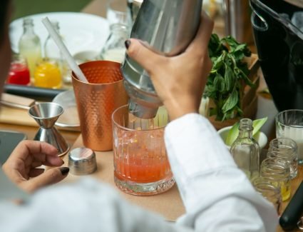 pexels photo 17850173 17850173 1 Close-up of hands mixing a cocktail with fresh ingredients at a bar in CDMX.